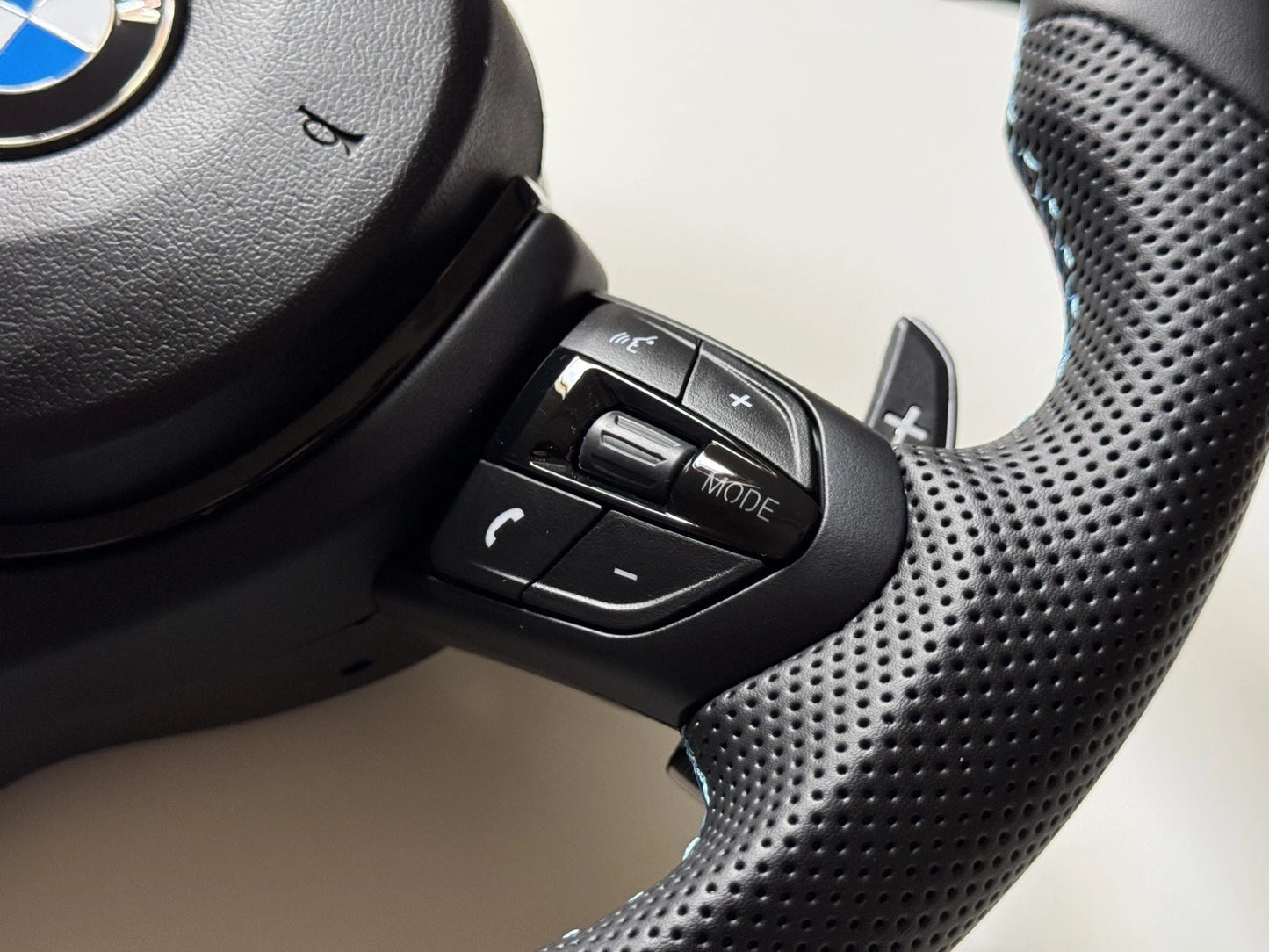 BMW M Sport flat bottom steering wheel, detail view of leather and flat bottom rim