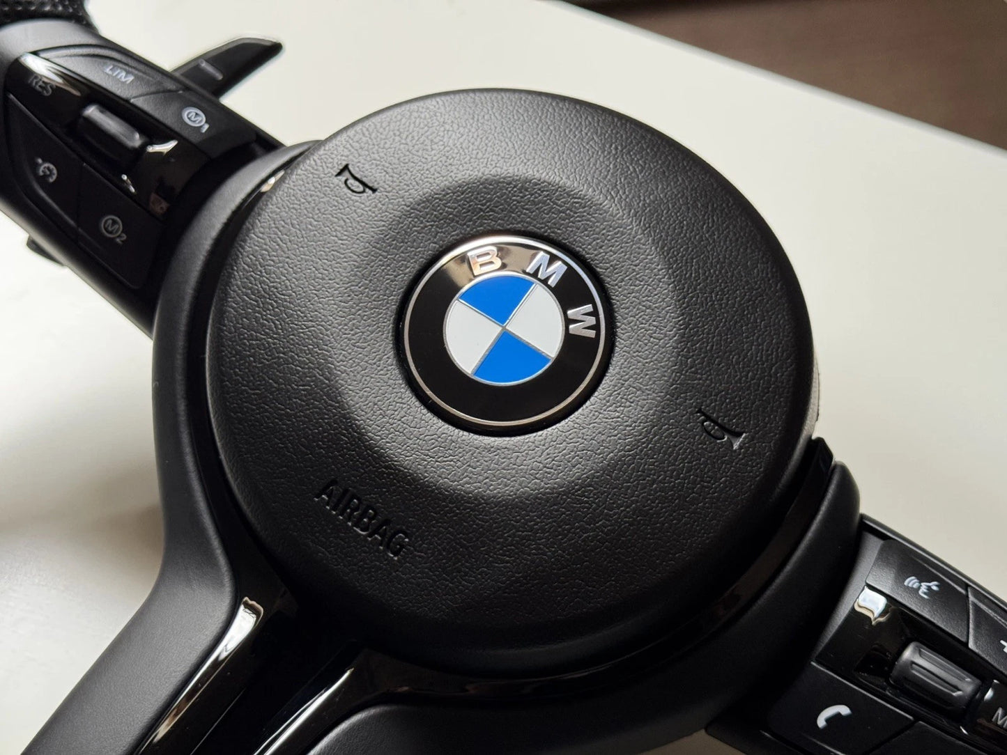 BMW M Sport flat bottom steering wheel, rear view showing plug and play connectors